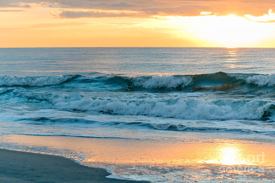 Wide sandy beach along the Arcadian Shores coastline near Shore Drive with the Atlantic Ocean and blue sky